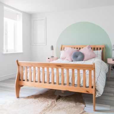 brighton airbnb master bedroom with pastel wall shape