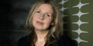 Melanie Barnes sitting on the stairs Melanie Barnes Elixir Interior Design